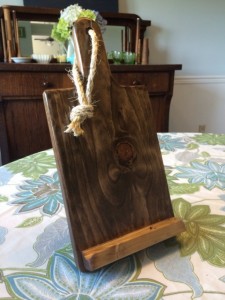 Jamie Cassidy of Voluntown Housewife - 3 Awesome Themed Gift Basket Ideas for Christmas 2015 Gift Ideas - iPad mini or Kindle stand, rustic wood cutting board stand